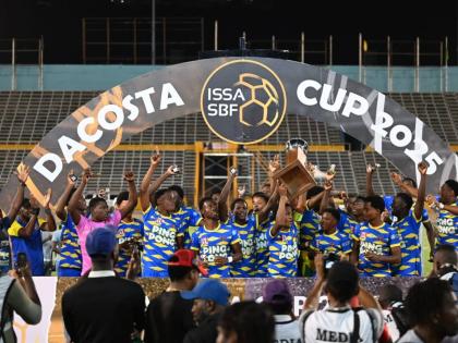 St Elizabeth Technical High School celebrate with the daCosta Cup trophy after edging Glenmuir High School on penalties in the final at the National Stadium on December 20, 2025.
