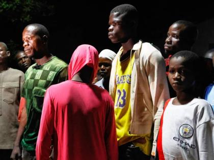Freed students of St. Mary’s Catholic School are reunited with their parents in Papiri community, Nigeria, Tuesday, December 9, 2025.