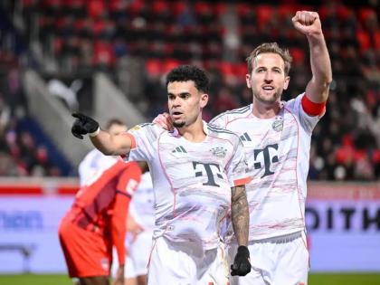 Bayern’s Luis Díaz (left) celebrates with Harry Kane after scoring their side’s third goal of the game during the Bundesliga match between FC Heidenheim and Bayern Munich in Heidenheim, Germany, yesterday.