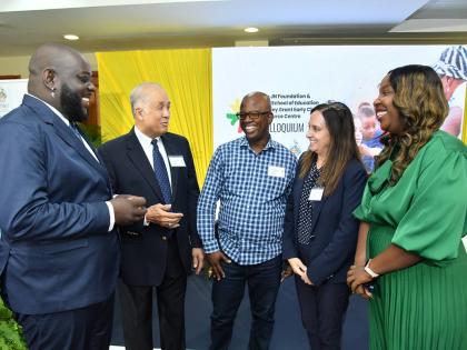 Parris Lyew-Ayee (second left), chairman, JN Foundation exchanges pleasantries with Dr. Tiou Clarke (left), lecturer at the University of Technology, Jamaica; Dr Ricardo Anderson (centre), lecturer in the Department of Computing, The University of the West