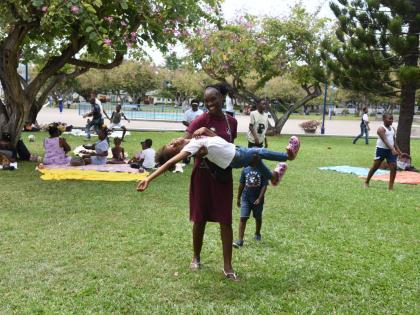 Children from the Bible Truth Ministry International (BTMI) enjoy themselves at Emancipation Park in New Kingston during an excursion earlier this year.