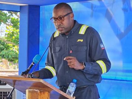 President and Chief Executive Officer of the Jamaica Public Service (JPS), Hugh Grant, speaking at the official launch of the JPS Emergency Mobile Power Generation Unit in Treasure Beach, St Elizabeth, on December 24, 2025.