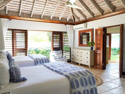 A stylish bedroom embracing the outdoors. 