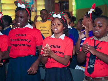 Students from Holy Family Primary light up the room with vibrant performances as part of the Child Resiliency Programme Christmas celebrations.