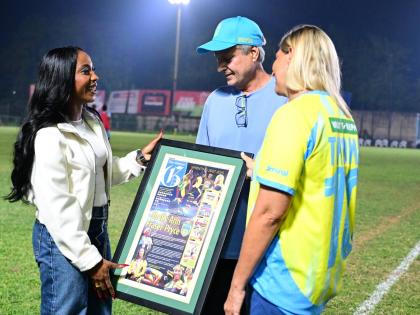 From left: Sprint legend Shelly-Ann Fraser-Pryce in dialogue with Bruce Bicknell, chairman, Waterhouse FC, and Nicola Bicknell, director, Waterhouse FC, moments after a presentation ceremony at the Waterhouse football field in Drewsland on Sunday.