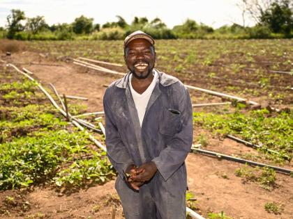 Farmer Noel Reid smiles for the camera despite reflecting on the over $4-million damage to his crops and farming equipment caused by Hurricane Melissa. 