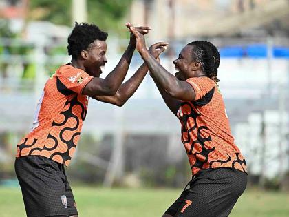 Tivoli Gardens FC goalscorer Rodico Wellington (right) celebrates with Daniel Watson during their Jamaica Premier League match against Chapelton Maroons at the Edward Seaga Sports Complex yesterday. Tivoli won 2-0.