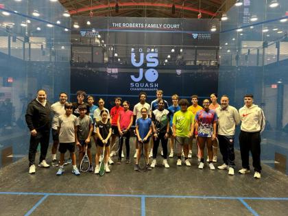Maximillian Woolf (front row, in green)  and Kaylee Pierre, in red, blue and white, with other junior competitors at a pre-tournament clinic at the US Junior Open. 
