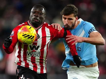 Sunderland’s Brian Brobbey (left) and Manchester City’s Ruben Dias in action during the English Premier League match between Sunderland and Manchester City in Sunderland, England, yesterday.