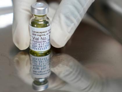 A pharmacist holds a vial of lenacapavir, an injectable HIV prevention drug.