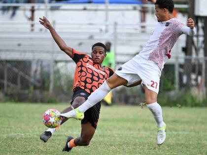 Tivoli Gardens’ Janoi Williams (left) makes a sliding tackle on Marcos Pegoretti Roas Filho of Chapelton Maroons during their Jamaica Premier League match at the Edward Seaga Sports Complex on Monday, December 29, 2025.