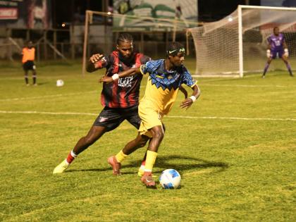 
Racing United FC’s Nickyle Ellis (right) moves away from Arnett Gardens’ Joel Jones during a Jamaica Premier League fixture at the Anthony Spaulding Sports Complex on December 29, 2025.