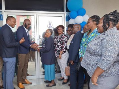 From left: Mark Smith, immediate past president of the Jamaica Teachers’ Association (JTA); Mark Malabver, president of the JTA; and Evelyn Tugwell, retired JTA western regional officer, cut the ribbon to reopen the JTA’s Western Regional Office in Mon