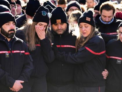 Firefighters cry as they attend a memorial march in Crans-Montana, Swiss Alps, Switzerland, to honour victims of devastating fire in Le Constellation bar.