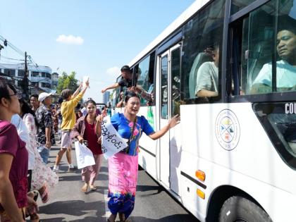 Released prisoners, in a bus, are welcomed by family members and colleagues after they left Insein Prison in Yangon, Myanmar. 