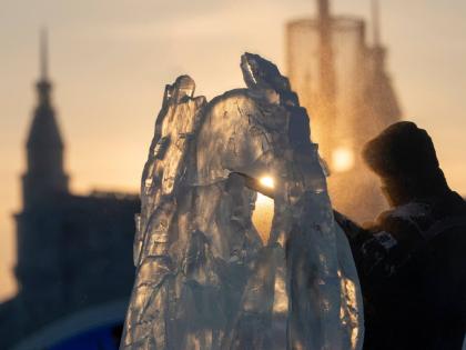An ice sculptor prepares his work for competition in the annual Ice and Snow Festival held in Harbin in China’s Heilongjiang province.