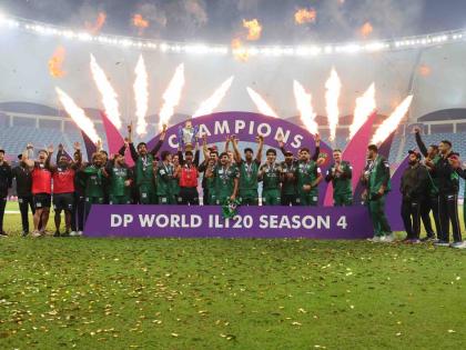 Desert Vipers players celebrate with the trophy after winning the final of the DP World International League T20 between against MI Emirates at the Dubai International Cricket Stadium, Dubai, United Arab Emirates, yesterday.