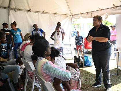 State Minister in the Ministry of Health and Wellness, Krystal Lee, addresses expectant and new mothers during a maternal health outreach at the Mount Carey Health Centre, St James, in December last year.