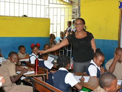 Principal of Petersfield Primary and Infant School, Susan Rattray Hammond, speaking to students in a classroom.