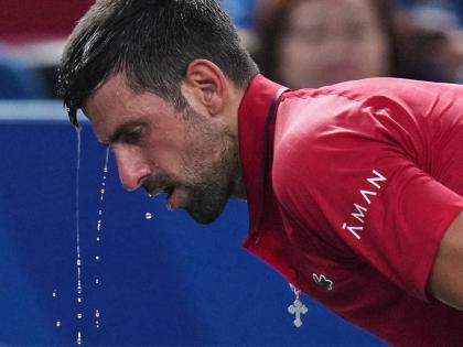Novak Djokovic of Serbia cools himself with water during the men’s singles semi-final match with Valentin Vacherot of Monaco at the Shanghai Masters tennis tournament at Qizhong Forest Sports City Tennis Centre, in Shanghai, China on October 11, 2025.