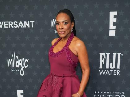 Sheryl Lee Ralph dons a deep burgundy Tony Ward Couture gown with handcrafted 3D embroidered motifs and jewellery by Selim Mouzannar. 