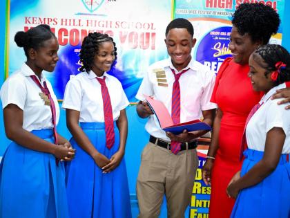 Principal of the Clarendon-based Kemps Hill High School, Karen Charlton Boothe (second right), in discussion with students at the institution recently. They are (from left) Trishana Ramdarsingh, Kaycia Cole; prefect, Kemoy Miller, and senior prefect, Shant