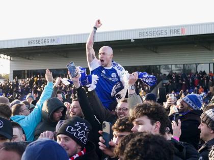 
Macclesfield Town’s Josh Kay celebrates with fans following the FA Cup third round football match against Crystal Palace at the Leasing.com Stadium, Macclesfield, England, yesterday.