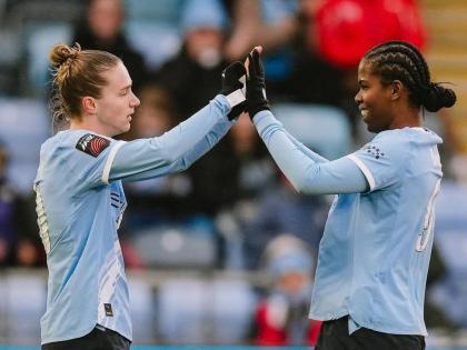 Manchester City’s Khadija Shaw (right) congratulates teammate Miedema after her assist led to the latter’s goal during a Women’s Super League football game against Everton at the Joie Stadium in Manchester, England, yesterday.