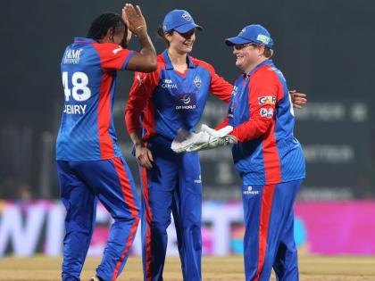 Delhi Capitals’ Chinelle Henry (left) and wicketkeeper Lizelle Lee (right) celebrate a wicket during a Women’s Premier League T20 cricket match against the Gujarat Giants at the Dr DY Patil Sports Academy on Sunday.