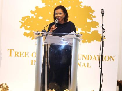 Minister in the Office of the Prime Minister with responsibility for Efficiency, Innovation and Digital Transformation, Ambassador Audrey Marks, delivers remarks after receiving the 2026 Golden Heart Award from the Tree of Life Foundation.