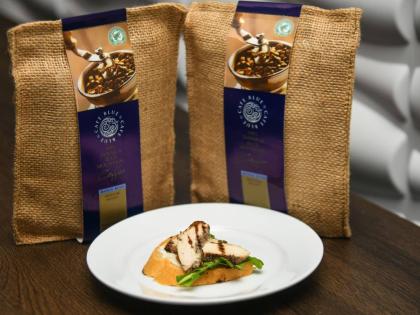 The coffee-glazed jerk chicken breast is served as a crostini and topped with a coffee balsamic sauce.