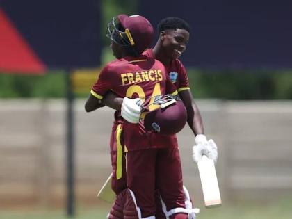 West Indies Under-19 batsmen Tanez Francis (left) and Shama Apple embrace in celebration of the latter’s century in an ICC U19 World Cup warm-up game against Japan. Francis also scored a century.