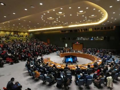 People listen as Venezuela’s UN Ambassador Samuel Moncada speaks during a meeting of the Security Council.
