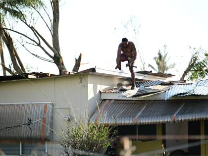 A homeowner in Black River, St Elizabeth, is seen repairing the roof of his house, which was destroyed by Hurricane Melissa last October.