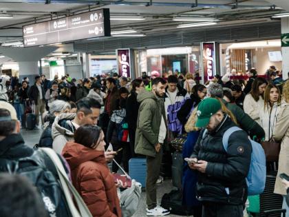 Passengers wait in the hall of Madrid train station on Sunday, January 18, 2026, following the announcement of the suspension of service due to an accident in which two trains derailed in Cordoba. ( Carlos Luján/Europa Press via AP)