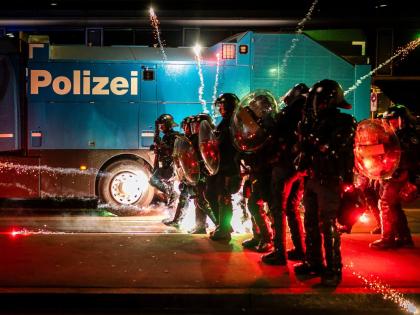 Riot police clash with protesters after a rally against the World Economic Forum in Davos and the visit of US President Donald Trump, on Monday, in Zurich, Switzerland, January 19, 2026. 