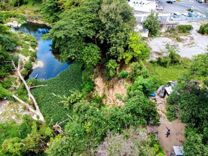 An aerial photograph of a house on Barrett Street in Spanish Town, St Catherine on Friday, July 17, 2020. The dwelling inches closer to the Rio Cobre with each heavy downpour of rainfall, as a result of soil erosion. 