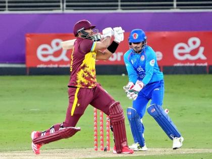 West Indies captain Brandon King pulls to leg during an innings of 50 against Afghanistan in the second T20 International in Dhubai yesterday. Looking on is Afghan wicketkeeper Rahmanullah Gurbaz.