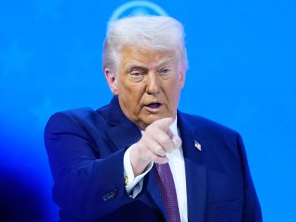President Donald Trump reacts during a signing ceremony on his Board of Peace initiative at the Annual Meeting of the World Economic Forum in Davos, Switzerland, Thursday, January 22, 2026. (AP Photo/Markus Schreiber)