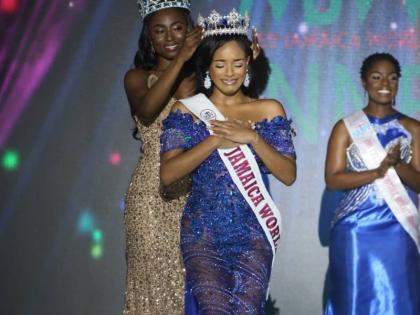 The new Miss Jamaica World Nevaeh Allen is crowned by Miss Jamaica World 2024 Tahje Bennett (left) during the competition’s grand coronation on Sunday night at the Karl Hendrickson Auditorium at Jamaica College.