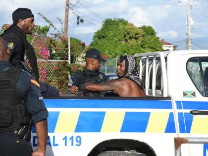 US-based Reggae Boy Cory Burke is taken away by members of the Jamaica Constabulary Force outside the Ferdi Neita Park in Portmore, St Catherine on January 25, 2026. 