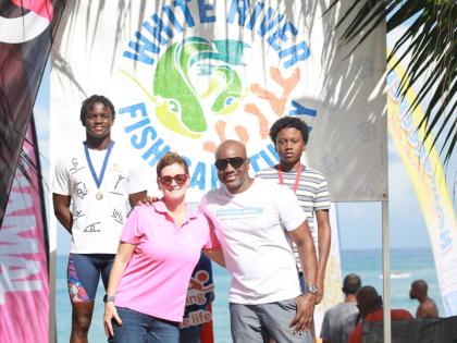 Medallists Brandon Wong (left) and Jaeden Tyler-Grant (right) are joined by Debra Lopez-Spence, president, Scotia Jamaica Life Insurance (second left), and Communications Manager Elon Parkinson of sponsors ScotiaInsurance  and Petrojam Limited, respectivel