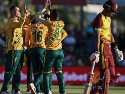South African players celebrate the wicket of West Indies captain Roston Chase during the first T20I in Paarl, South Africa, yesterday.