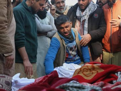 A grieving man reacts as relatives gather around the bodies of victims of a house collapse during a funeral procession in Jalalabad, Afghanistan, Thursday, January 29, 2026. 