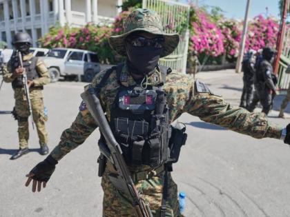 Members of the National Palace General Security Unit (USGPN) set up a security perimeter as Transitional Council President Laurent Saint-Cyr visits the headquarters of the armed forces in Port-au-Prince, Haiti, Monday, January, 2025. 
