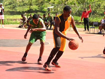 York Castle High’s Omar Campbell (right) dribbles away from  Belair High’s Raheem Irvin during their ISSA Rural Schoolboys Basketball match at York Castle’s court on Wednesday, January 28, 2026.