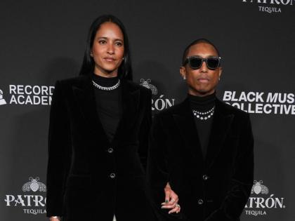 Helen Lasichanh (left) and Pharrell Williams attend the Recording Academy Honors presented by the Black Music Collective last Thursday, in Los Angeles. 