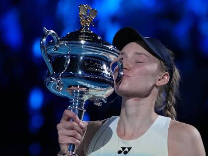 
Elena Rybakina of Kazakhstan kisses the Daphne Akhurst Memorial Cup after defeating Aryna Sabalenka of Belarus to win the women’s singles final at the Australian Open tennis championship in Melbourne, Australia, yesterday.
