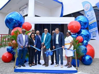 Prime Minister Dr Andrew Holness (fourth right) cuts the ribbon to officially open the new Parent Overnight Suite at the Bustamante Hospital for Children. Also pictured (from left) are Linval Freeman, NHT chairman; Dr Michelle Ann Richards-Dawson, senior m