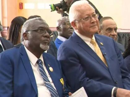 Justice and Constitutional Affairs Minister Delroy Chuck (right) sits with St James Custos Bishop Conrad Pitkin during the commissioning of 28 new justices of the peace for St James at the Grand-A-View Events Place in Montego Bay, St James, last Friday.